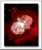 A huge, billowing pair of gas and dust clouds are captured in this stunning NASA Hubble Space Telescope image of the supermassive star Eta Carinae. Even though Eta Carinae is more than 8,000 light-years away, structures only 10 billion miles across (about the diameter of our solar system) can be distinguished. Dust lanes, tiny condensations, and strange radial streaks all appear with unprecedented clarity.  Estimated to be 100 times more massive than our Sun, Eta Carinae may be one of the most massive stars in our Galaxy. It radiates about five million times more power than our Sun.